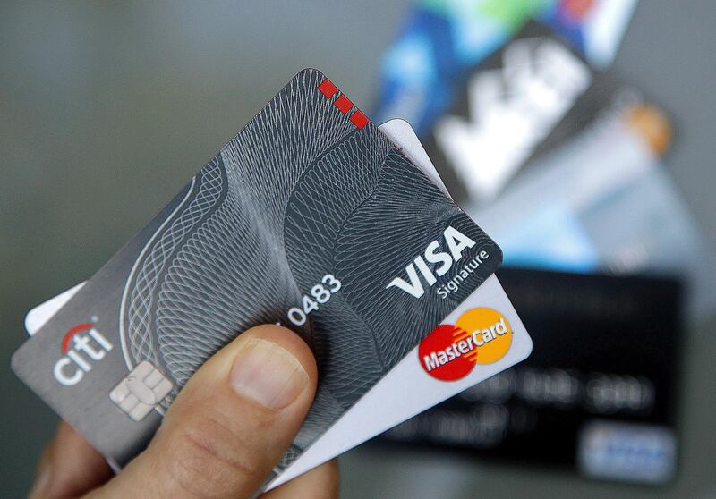 FILE - In this June 15, 2017, file photo, credit cards are displayed in Haverhill, Mass. If you have excellent credit, you can use your credit rating to your financial advantage without borrowing money. Oddly, exploiting your great credit rating often improves it. (AP Photo/Elise Amendola, File)