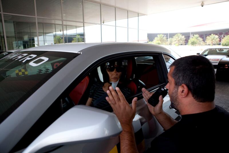 Abu Dhabi, United Arab Emirates, May 27, 2013:    An instructor explains how to operate a Chevrolet Camaro SS during a corporate open day at the Yas Marina Circuit in Abu Dhabi on May 27, 2013. Christopher Pike / The National\

