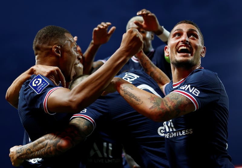 Mbappe celebrates with Marco Verratti and teammates. AP