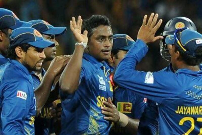 Ajantha Mendis, centre, derailed Pakistan in their run chase with two crucial blows.