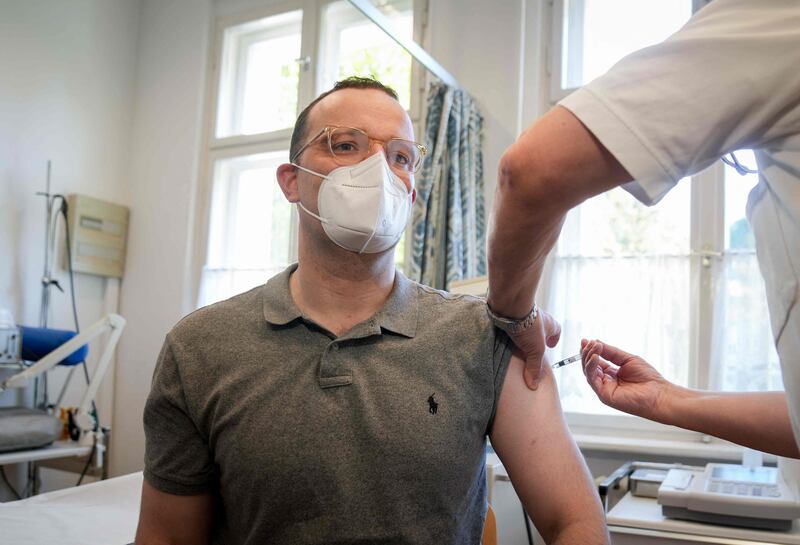 German Health Minister Jens Spahn gets an influenza vaccination at a doctor's surgery in Berlin. AFP