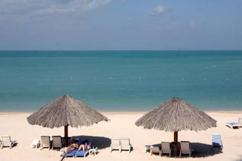 Ras Al Khaimah - February, 3, 2009 - Guests found to the Hilton Resort and Spa enjoying the afternoon sun on the Persian Gulf in Ras Al Kahimah, February 3, 2009. (Photo by Jeff Topping/ The National ) *** Local Caption ***  JT015-0203-RAK TRAVEL IMG_7225.jpgNS07FE RAK TRAVEL 04.jpg