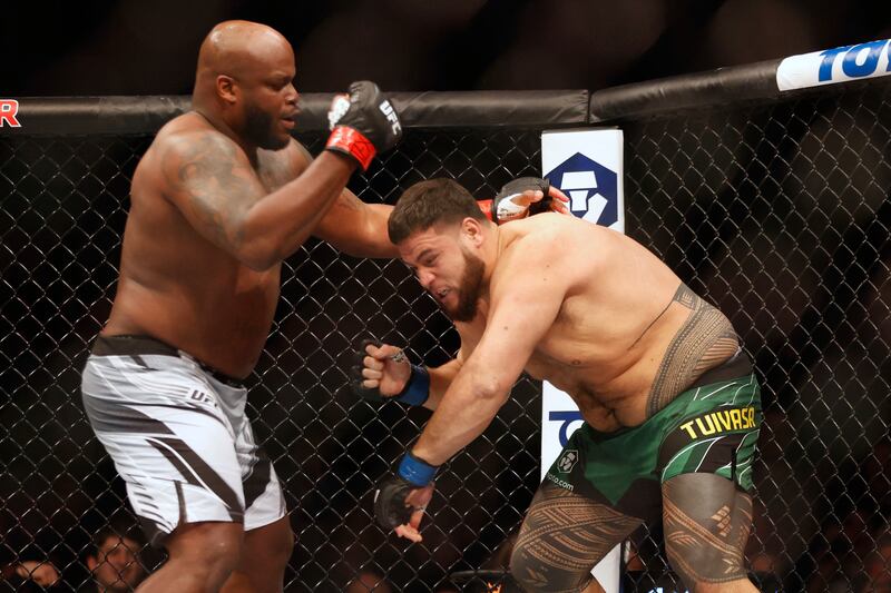 Tai Tuivasa evades a punch from Derrick Lewis during their fight at UFC 271. USA Today