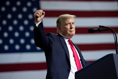 TOPSHOT - US President Donald Trump speaks during a campaign rally at the Florida State Fairgrounds Expo Hall in Tampa, Florida, on July 31, 2018. / AFP PHOTO / SAUL LOEB