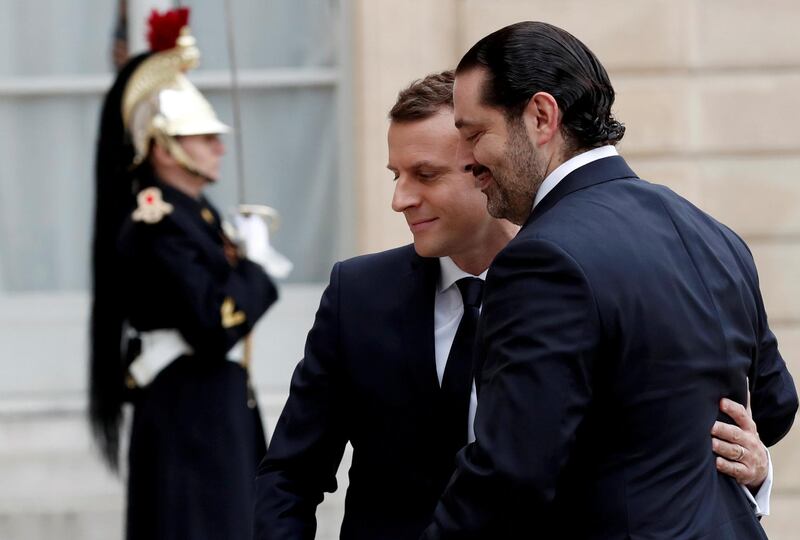 French President Emmanuel Macron and Saad al-Hariri, who announced his resignation as Lebanon's prime minister while on a visit to Saudi Arabia, walk together in the courtyard the Elysee Palace in Paris, France, November 18, 2017. REUTERS/Benoit Tessier     TPX IMAGES OF THE DAY