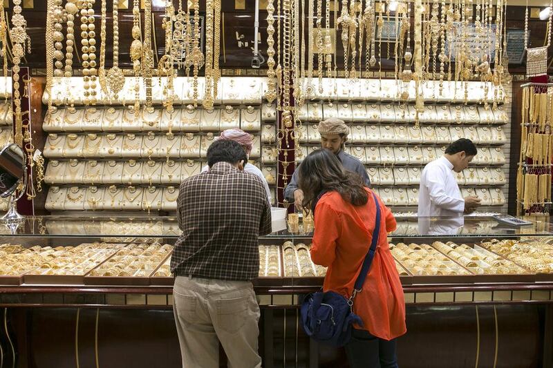 Shoppers inside a jewellry shop at the Gold Souk in Deira. Reem Mohammed / The National  