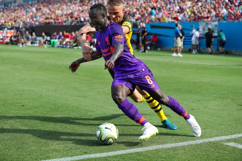 Borussia Dortmund's Amos Pieper defends Liverpool's Naby Keita. Reuters