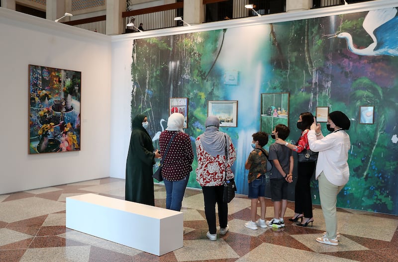 Visitors at the Farah Al Qasimi exhibition. Pawan Singh / The National 