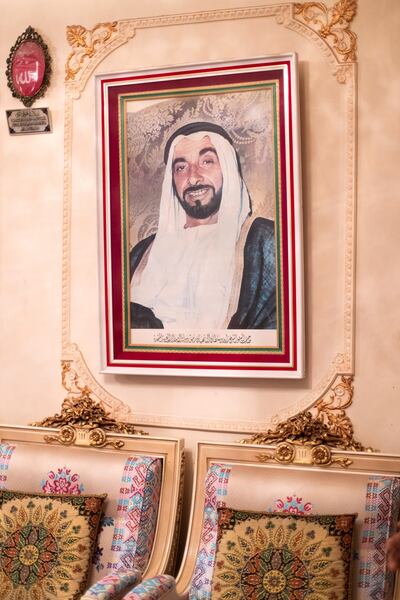 ABU DHABI, UNITED ARAB EMIRATES - May 23 2019.

A photo of Sheikh Zayed hangs in Siddiq Al Khaja home.

(Photo by Reem Mohammed/The National)

Reporter: SHIREENA AL NOWAID
Section: NA