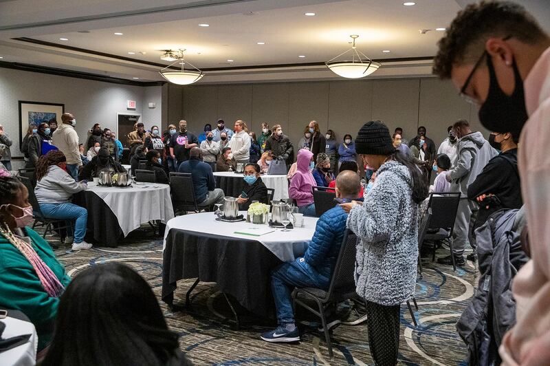 Family and friends wait for word of their loved ones who were at the FedEx Ground facility during a shooting in Indianapolis. AP Photo