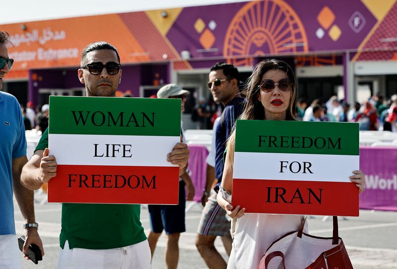 Support shown for Iranians' freedom outside the Khalifa International Stadium before the match between Iran and England. Reuters
