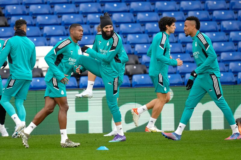 Real Madrid's Karim Benzema, centre, warms up with team-mates. AP