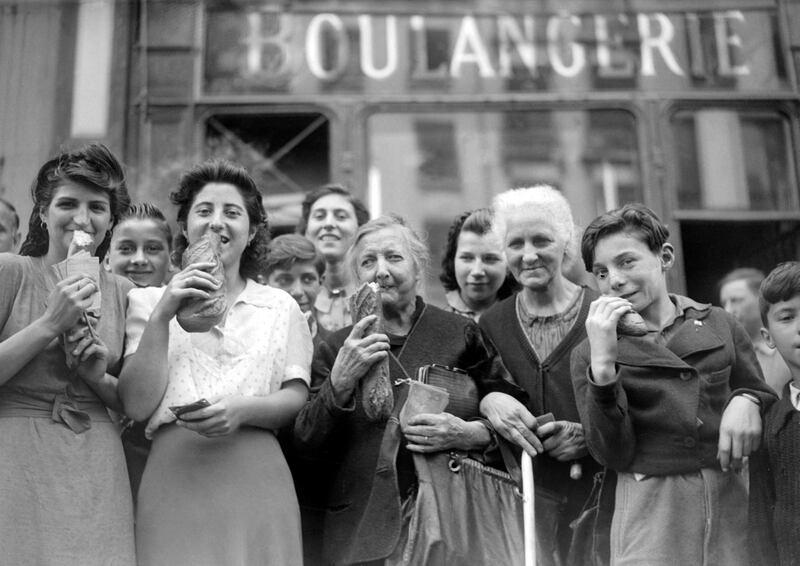 Parisians in 1944 buying bread after years of living of on rations. AFP