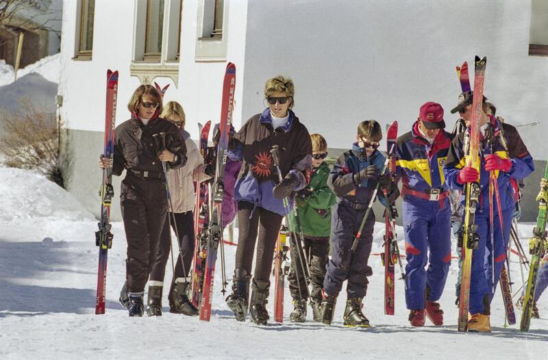 British Royal Diana, Princess of Wales (1961-1997), Prince Harry, and Prince William carrying their skis during a skiing holiday in Lech am Arlberg, Austria, 25th March 1994. (Photo by Princess Diana Archive/Hulton Archive/Getty Images)