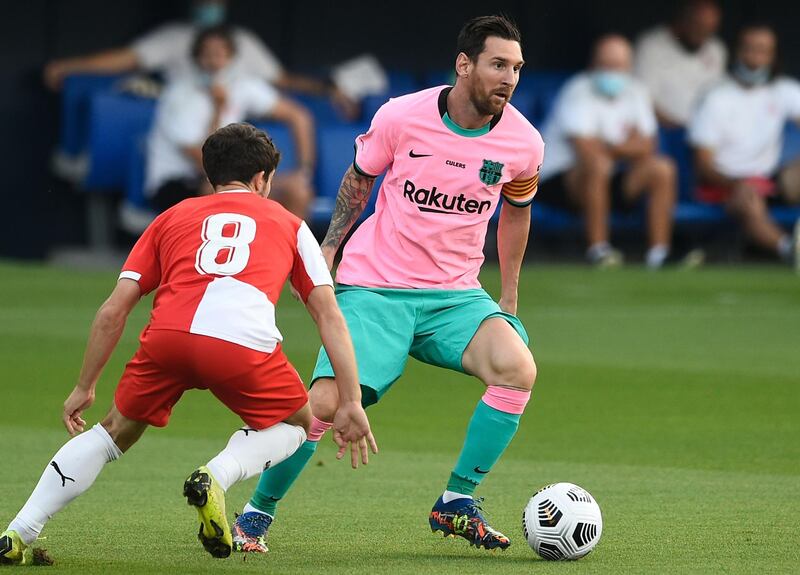 Lionel Messi under peressure from Girona midfielder Jairo Izquierdo. AFP