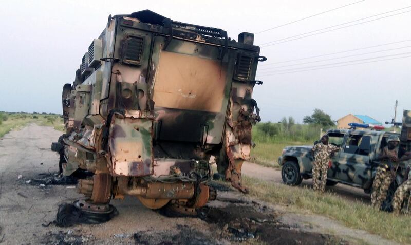 FILE PHOTO: A damaged military vehicle is pictured in the northeast town of Gudumbali, after an attack by members of Islamic State in West Africa (ISWA), Nigeria September 11, 2018. Picture taken September 11, 2018. REUTERS/Kolawole Adewale/File Photo