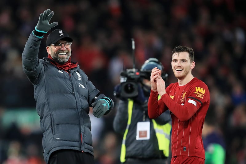 LIVERPOOL, ENGLAND - NOVEMBER 30: Jurgen Klopp, Manager of Liverpool and Andy Robertson of Liverpool celebrate win after the Premier League match between Liverpool FC and Brighton & Hove Albion at Anfield on November 30, 2019 in Liverpool, United Kingdom. (Photo by Marc Atkins/Getty Images)
