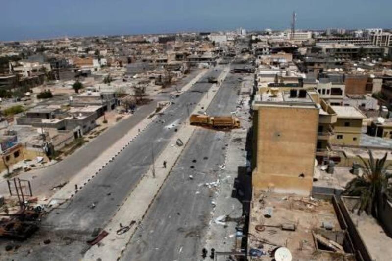The besieged city is seen from a high building in Misrata, Libya, Saturday, April 23, 2011. Government troops retreated to the outskirts of Misrata under rebel fire Saturday and the opposition claimed victory after officials in Tripoli decided to pull back forces loyal to Moammar Gadhafi following nearly two months of laying siege to the western city.  (AP Photo) *** Local Caption ***  CAI113_APTOPIX_Mideast_Libya.jpg