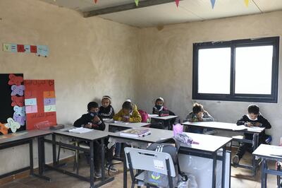 Due to limited space at the school, two grades share a classroom, in Ras a-Tin, north-east of Ramallah in the occupied West Bank. Rose Scammell for The National