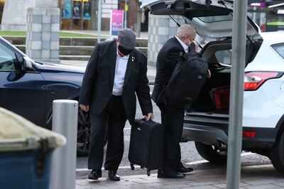 David Holden, left, arrives at Laganside Courts in Belfast. PA