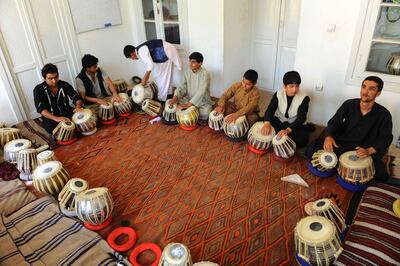 Afghan music students play traditional drums in a photo from 2013. The Central Asian nation has an ancient tradition of songs built on its rich culture of poetry, ranging from war and epic tales of life in this harsh land to delicate love stories. AFP