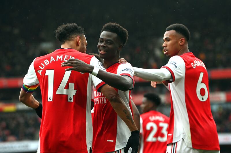 Bukayo Saka celebrates with teammates after scoring the opening goal for Arsenal against Newcastle. EPA