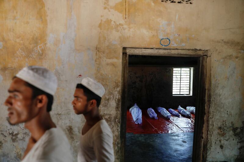 Bodies of Rohingya refugees, who died when their boat capsized while fleeing Myanmar, are placed in a local madrasa near Cox's Bazar in Bangladesh. Damir Sagolj / Reuters