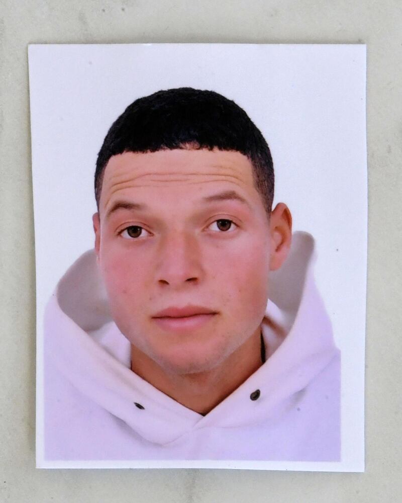 An identity picture of the Nice assailant Brahim Aouissaoui, who a day earlier killed three people and wounded several others in the southern French city of Nice, is pictured at his family home in the Tunisian city of Sfax, on October 30, 2020.  The knife attacker killed three people, cutting the throat of at least one woman, inside a church in Nice on the French Riviera. / AFP / AFPTV teams
