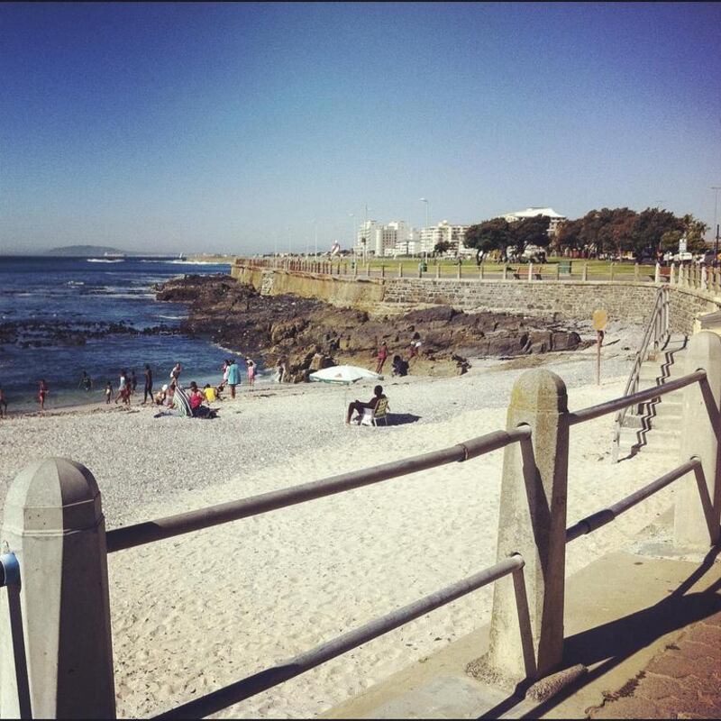 People enjoy a sunny day on the beach in Sea Point near Cape Town. Antonie Robertson