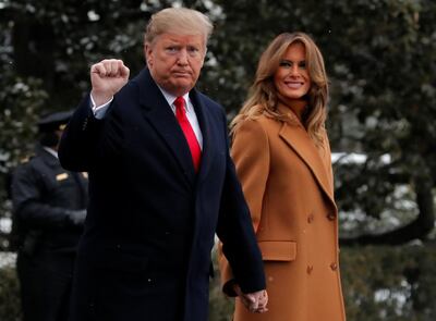 U.S. President Donald Trump walks with first lady Melania Trump while departing for Palm Beach, Florida from the White House in Washington, U.S., February 1, 2019. REUTERS/Jim Young