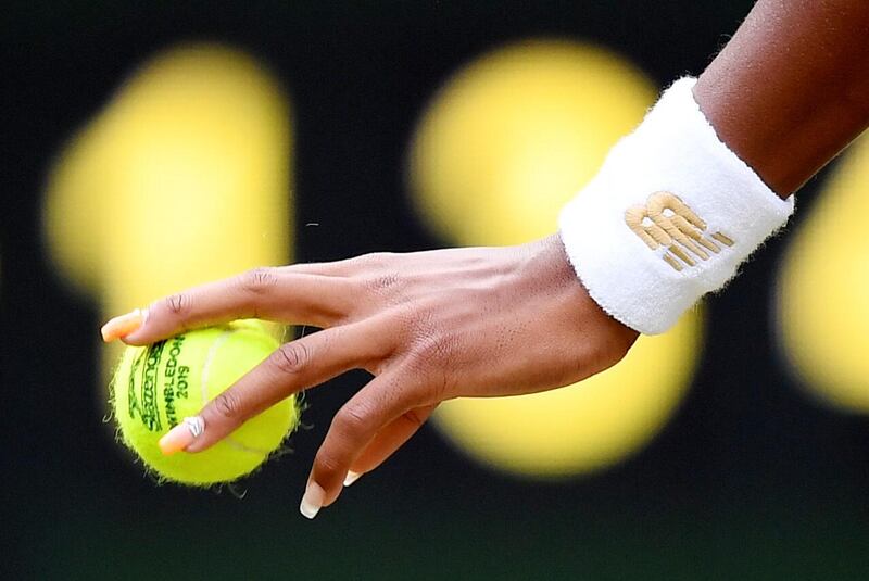 Gauff holds the ball. Reuters