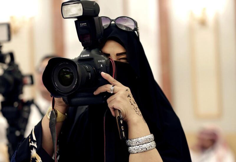 Above, a female Saudi journalist at work in Riyadh. Saudi officials are clarifying misconceptions about male guardianship, which is often confused with cultural habits. Hasan Jamali / AP Photo