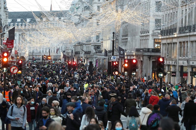Shoppers are seen on Regent street in London. Reuters