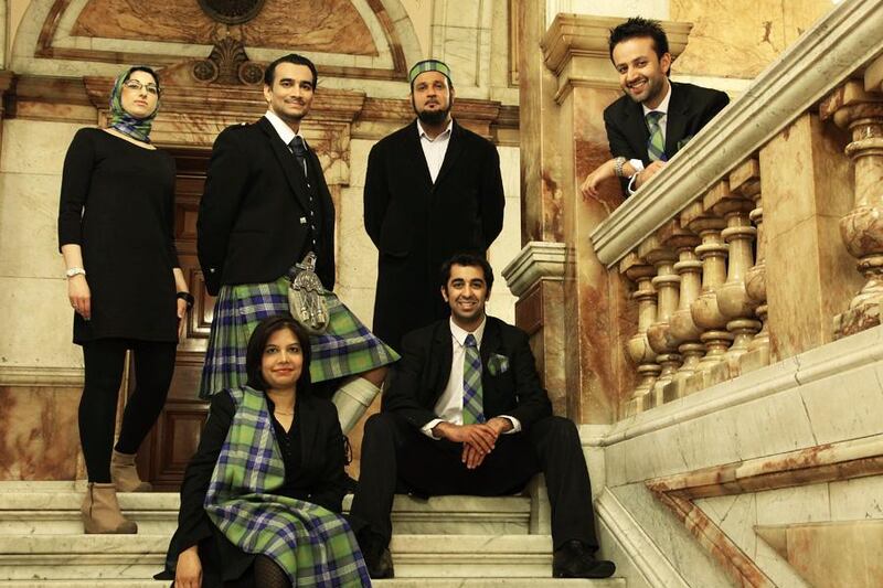 Scotland's Islamic Tartan was released in 2012, modelled on the grand staircase of Glasgow's City Chambers. From left to right, standing: Shabnum Mustapha, Azeem Ibrahim, Shaikh Amer Jamil, Osama Saeed; Sitting: Shazia Akhtar, Humza Yousaf. Courtesy Islamic Tartan