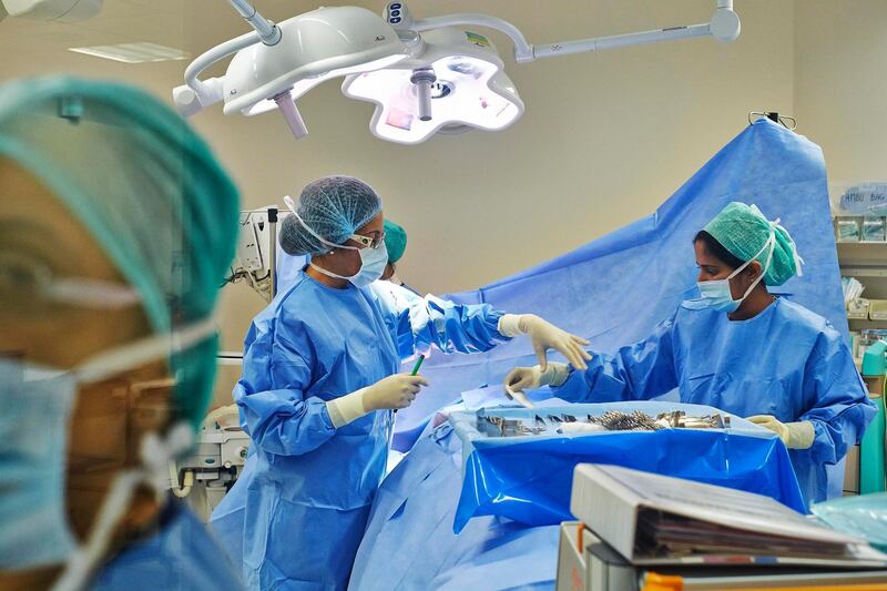 DUBAI, UNITED ARAB EMIRATES,  JUNE 17, 2013. Working moms. Dr. Houriya Kazim BSc, MPH, MB BCh, FRCS, Medical Director and Specialist Breast Surgeon, an Emirati and the country's first female surgeon at work on a surgery at the Dubai London Speciailty Hosptial on Beach rd.  Freelancer is Rachel Lewis. (ANTONIE ROBERTSON / The National)