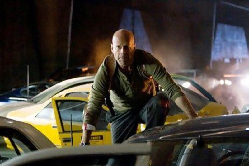 Willis as Detective John McClane fights off cyber-terrorists in Die Hard 4.0. AP Photo / Fox