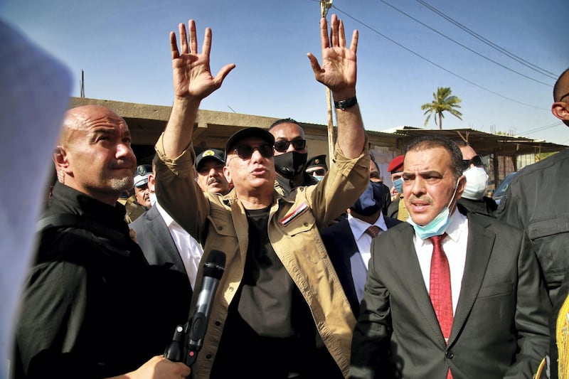 Iraqi Prime Minister Mustafa al-Kadhimi speaks to locals in Tarmiyah, Iraq July 20, 2020. Khalid Mohammed/Pool via REUTERS