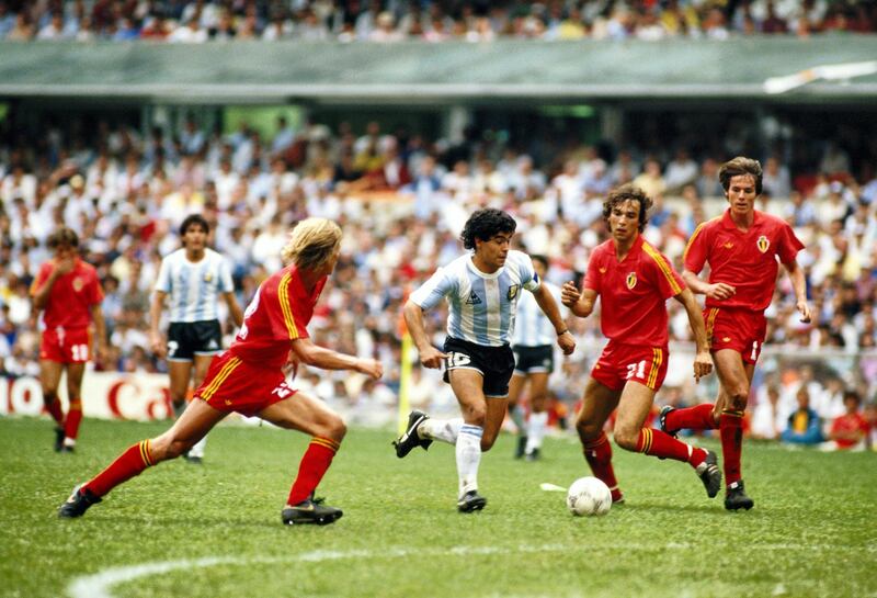 Patrick Vervoort of Belgium closes in on Diego Maradona of Argentina as Stefan Demol (21) of Belgium looks on during the 1986 FIFA World Cup Semi Final on 25 June 1986 at the Azteca Stadium in Mexico City, Mexico. Argentina defeated Belgium 2-0. (Photo by Mike King/Getty Images)