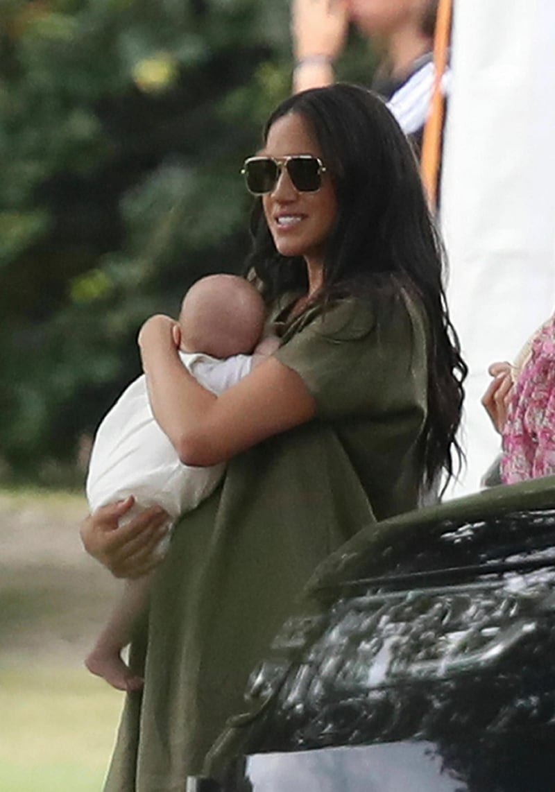 Meghan, Duchess of Sussex holds baby Archie at the Royal Charity Polo Day. AP