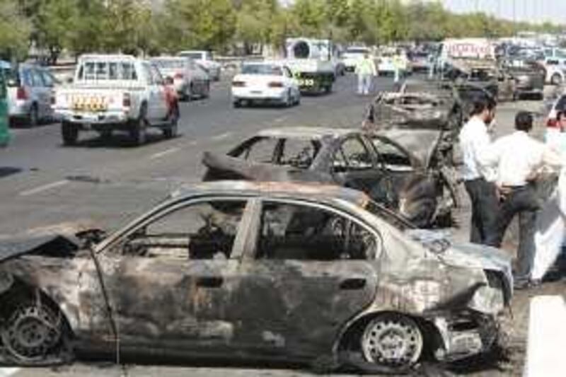 ABU DHABI,UNITED ARAB EMIRATES - March 11 : Cars were burned after 200 hundred cars collide due to heavy fog that resulted to the death of six people in Abu Dhabi - Dubai Highway Ghantoot. [ Photo by Paulo Vecina / The Nation } *** Local Caption *** PV Collision 18.JPG