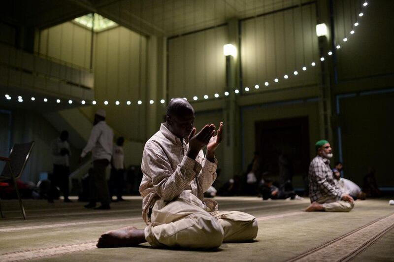 A Muslim American man prays after breaking fast at the Islamic Cultural Centre in Manhattan, New York City. Amr Alfiky / Reuters