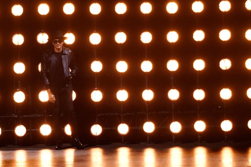 French designer Hedi Slimane appears at the end of the show. AFP