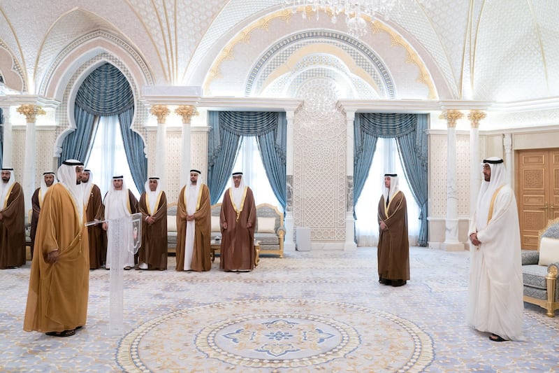 ABU DHABI, UNITED ARAB EMIRATES - March 10, 2019: HE Major General Faris Khalaf Al Mazrouei, Commander-in-Chief of Abu Dhabi Police and Abu Dhabi Executive Council Member (L),  gives his oath during a swearing-in ceremony for new members of the Abu Dhabi Executive Council, at the Presidential Palace. Witnessed by HH Sheikh Mohamed bin Zayed Al Nahyan, Crown Prince of Abu Dhabi and Deputy Supreme Commander of the UAE Armed Forces (R), HH Sheikh Hazza bin Zayed Al Nahyan, Vice Chairman of the Abu Dhabi Executive Council (back 2nd R), HH Sheikh Hamed bin Zayed Al Nahyan, Chairman of the Crown Prince Court of Abu Dhabi and Abu Dhabi Executive Council Member (3rd R), HH Sheikh Diab bin Zayed Al Nahyan (4th R), HE Jassem Mohamed Bu Ataba Al Zaabi, Chairman of Abu Dhabi Executive Office and Abu Dhabi Executive Council Member (4th R), HE Dr Ahmed Mubarak Al Mazrouei, Secretary General of the Abu Dhabi Executive Council (5th R), HE Sheikh Abdulla bin Mohamed Al Hamed, Chairman of the Health Department and Abu Dhabi Executive Council Member (6th R),HE Saif Mohamed Al Hajeri, Chairman of Department of Economic Development, and Abu Dhabi Executive Council Member (7th R) and HE Mohamed Khalifa Al Mubarak, Chairman of the Department of Culture and Tourism and Abu Dhabi Executive Council Member (back L). 

( Mohamed Al Hammadi / Ministry of Presidential Affairs )
---