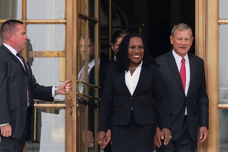 Ms Brown Jackson and Mr Roberts after her formal investiture ceremony at the Supreme Court in Washington. AP