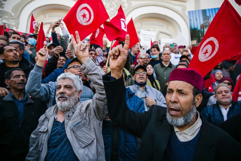 Demonstrators take to the streets of Tunis to protest against Tunisian President Kais Saied eight months after he dismissed the government. AP