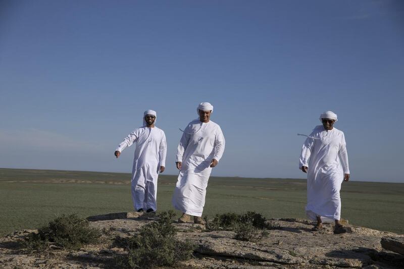 Falconers from the private office of Sheikh Mohammed bin Zayed al Nahyan and staff from the International Fund for Houbara Conservation and the Abu Dhabi Falcon Hospital survey the landscape as they prepare to release falcons back into the wild north of the coastal city of Aktau in southwest Kazakhstan.
