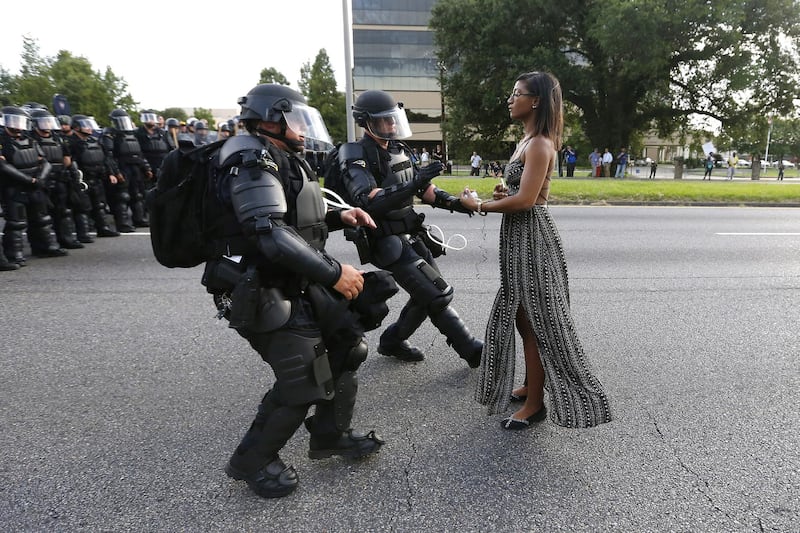 Lone activist Ieshia Evans stands her ground while offering her hands for arrest as she is charged by riot police during a protest against police brutality outside the Baton Rouge Police Department in Louisiana, on July 9 2016. Jonathan Bachman / Reuters