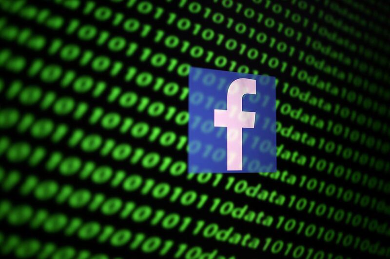 FILE PHOTO: The Facebook logo and binary cyber codes are seen in this illustration taken November 26, 2019. REUTERS/Dado Ruvic/Illustration/File Photo