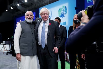 UK Prime Minister Boris Johnson receives Indian Prime Minister Narendra Modi at Cop26 in Glasgow last November. Reuters