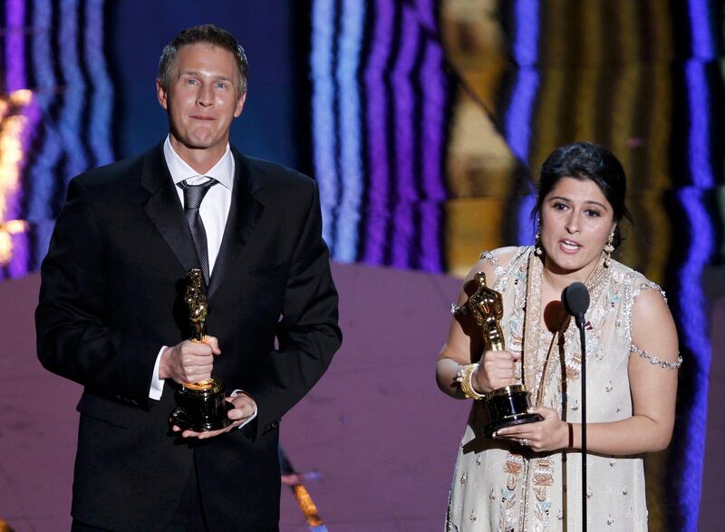 Daniel Junge and Sharmeen Obaid-Chinoy accept the Oscar for the Best Documentary Short Subject for their film "Saving Face" at the 84th Academy Awards in Hollywood, California, February 26, 2012.  REUTERS/Gary Hershorn  (UNITED STATES) (OSCARS-SHOW) *** Local Caption ***  OSC100_OSCARS-_0227_11.JPG